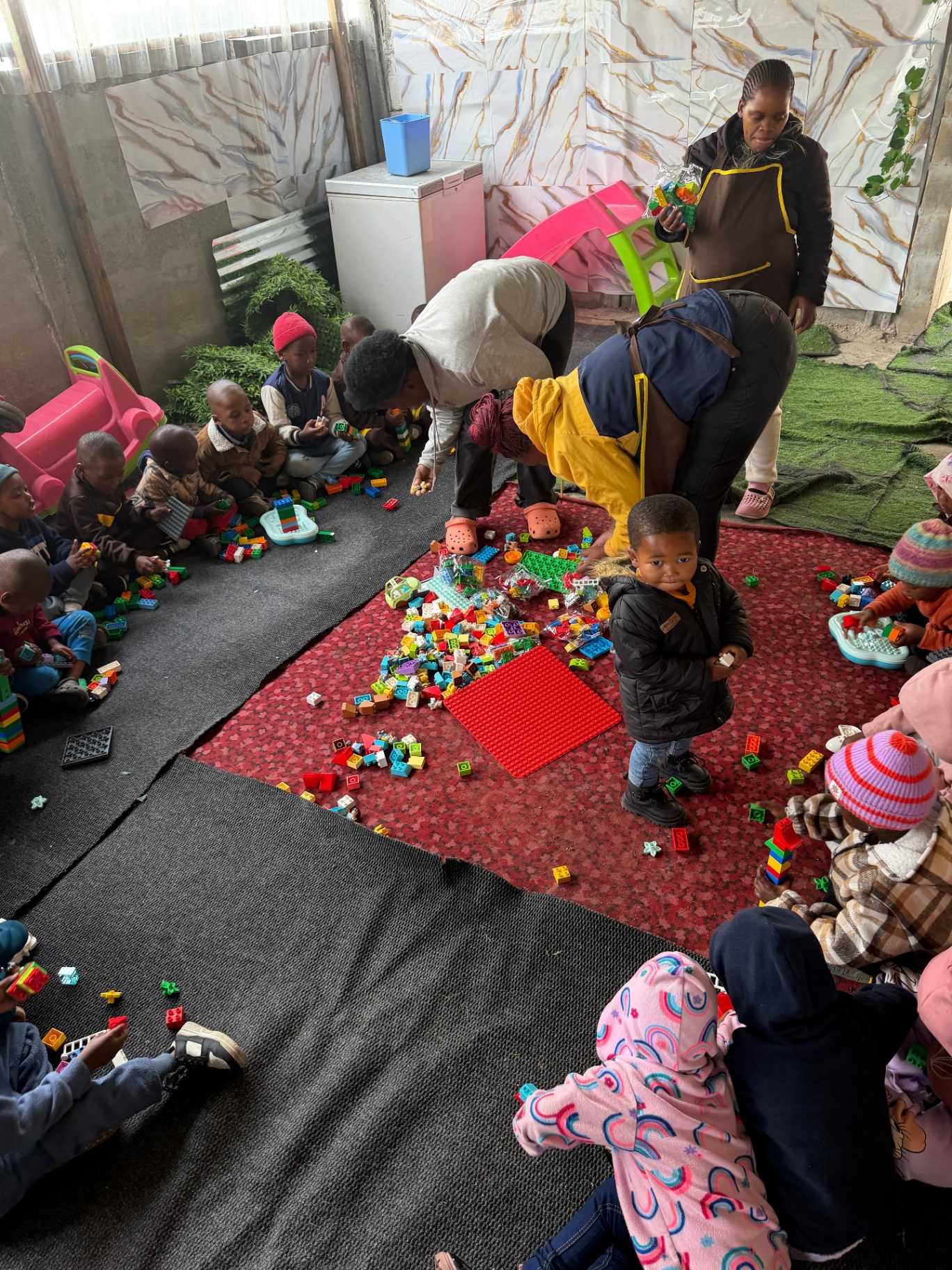 Children sharing new legos during playtime