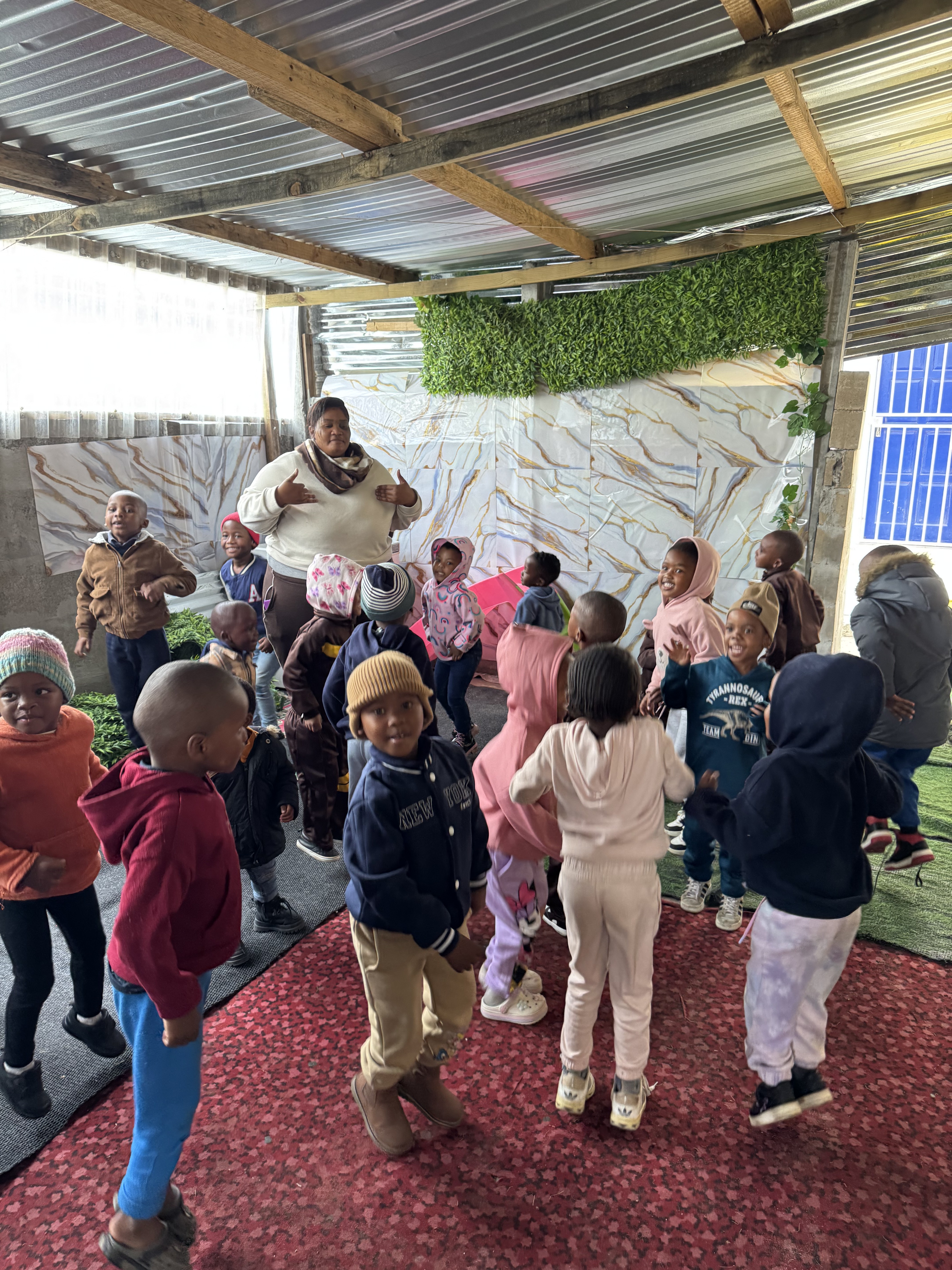 Children performing and dancing to a nursery rhyme