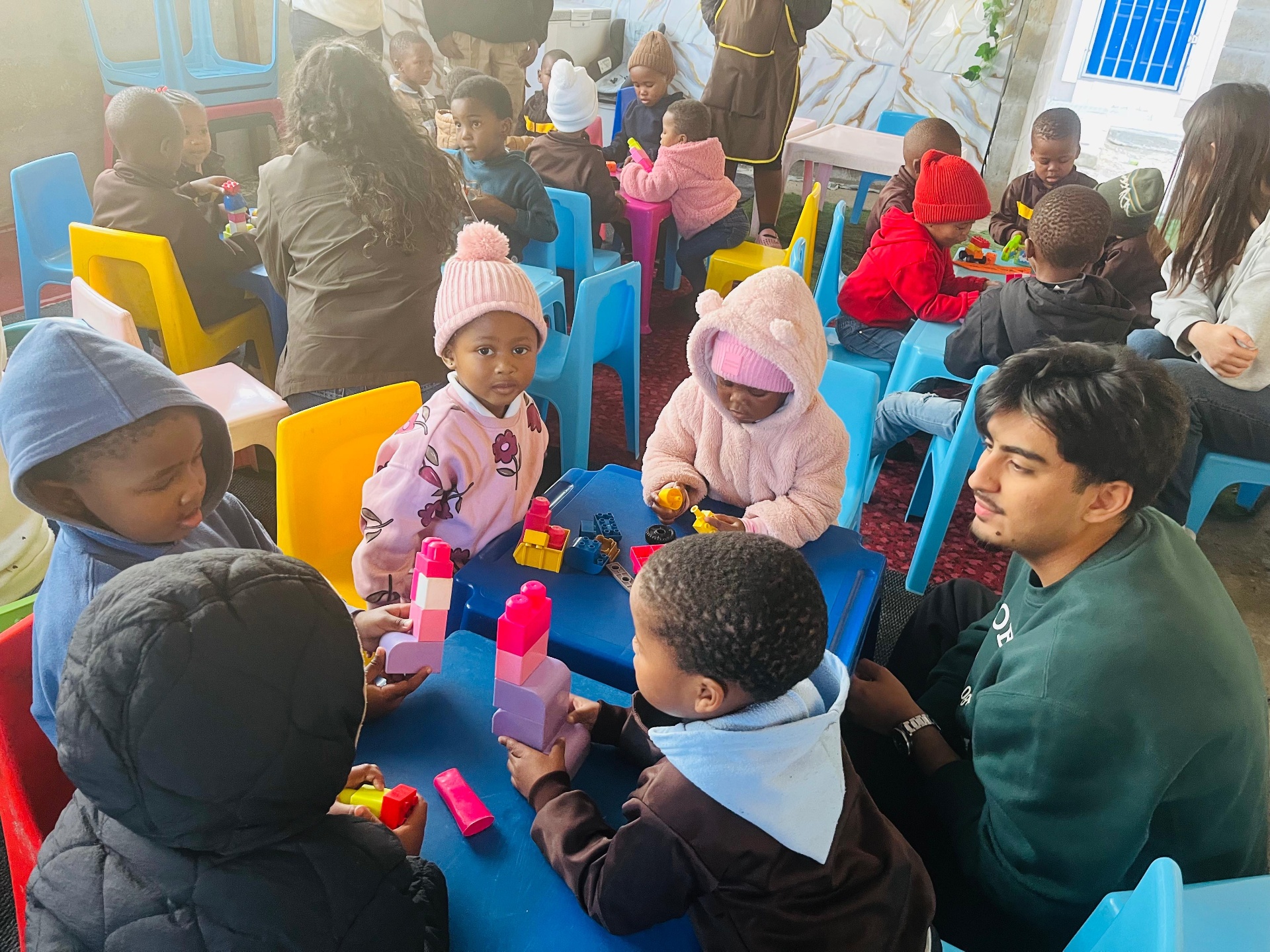 Children laughing together at Entuthuko Day & Aftercare Centre in Langa